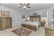 Spacious main bedroom features a ceiling fan, and traditional-style furniture at 560 Pier Ct., Longs, SC 29568