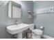 Elegant half-bath with pedestal sink, toilet, and tastefully decorated walls at 587 Starlit Way, Myrtle Beach, SC 29579