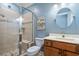 Bathroom featuring walk-in shower, modern vanity with light-colored countertop and tiled shower stall at 587 Starlit Way, Myrtle Beach, SC 29579