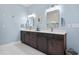 Bright bathroom featuring double vanity with dark cabinets, white countertop and light blue walls at 587 Starlit Way, Myrtle Beach, SC 29579