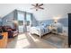 Cozy bedroom featuring a chair, rug and windows for natural light at 587 Starlit Way, Myrtle Beach, SC 29579