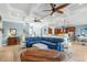 Open-concept living room with coffered ceilings flows into a chef's kitchen and dining area at 587 Starlit Way, Myrtle Beach, SC 29579