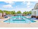 Community swimming pool with fountain feature and a bridge, surrounded by lush landscaping at 587 Starlit Way, Myrtle Beach, SC 29579