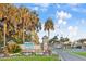 Beautifully landscaped entrance sign for Ocean Lakes with colorful seasonal flowers, shrubbery and mature palm trees at 6001-0917 S Ocean Blvd., Myrtle Beach, SC 29575