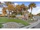 Beautifully landscaped entrance sign for Ocean Lakes with colorful seasonal flowers, shrubbery and mature palm trees at 6001-0917 S Ocean Blvd., Myrtle Beach, SC 29575