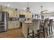 Stylish kitchen with a breakfast bar, pendant lighting, stainless steel appliances, and custom cabinets at 6001-0917 S Ocean Blvd., Myrtle Beach, SC 29575