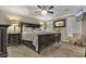 Large main bedroom with ceiling fan, carpeting, neutral colors and two windows at 6001-0917 S Ocean Blvd., Myrtle Beach, SC 29575