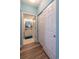 Hallway with laundry closet and entry to a remodeled bathroom with updated vanity at 601 Hillside Dr. N # 3736, North Myrtle Beach, SC 29582