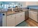 View of the updated kitchen with stainless steel appliances, granite counters and sink at 601 Hillside Dr. N # 3736, North Myrtle Beach, SC 29582