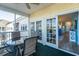 View of a covered outdoor patio with seating leading to the interior of the condo at 601 Hillside Dr. N # 3736, North Myrtle Beach, SC 29582