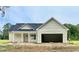 Charming single-story home with a covered porch, garage and light siding at 6049 Hodges Rd., Conway, SC 29527