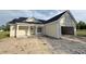A quaint single-story home featuring a welcoming covered porch and an attached garage at 6049 Hodges Rd., Conway, SC 29527