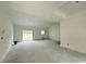 Large living room with neutral walls, base trim, backyard view and natural light at 6049 Hodges Rd., Conway, SC 29527