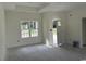 Bright living room with neutral walls, base trim, and natural light at 6049 Hodges Rd., Conway, SC 29527