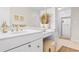 Bright bathroom featuring white vanity and countertop, stool, and shower at 616 36Th Ave. S, North Myrtle Beach, SC 29582