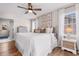 Cozy bedroom with a ceiling fan, dresser, and two windows with natural light at 616 36Th Ave. S, North Myrtle Beach, SC 29582