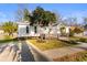 Charming home features a well-maintained lawn, sidewalk, and a cozy front porch for relaxed outdoor living at 616 36Th Ave. S, North Myrtle Beach, SC 29582