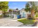 Home's backyard featuring a screened-in porch, convenient access, and a charming outdoor space at 616 36Th Ave. S, North Myrtle Beach, SC 29582