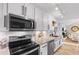 Spacious kitchen featuring white cabinets, granite countertops, and stainless steel appliances at 616 36Th Ave. S, North Myrtle Beach, SC 29582