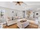 Open-concept living room flows into dining area with comfortable furniture and neutral decor at 616 36Th Ave. S, North Myrtle Beach, SC 29582