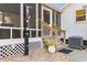 Backyard view of screened in porch with stairs and an outdoor shower feature at 616 36Th Ave. S, North Myrtle Beach, SC 29582