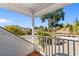 View from balcony shows a sunny neighborhood with palm trees and a view of the garages at 704 Compass Pointe Dr, North Myrtle Beach, SC 29582