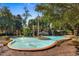 Serene community entrance with fountain, manicured landscaping, and American flag at 704 Compass Pointe Dr, North Myrtle Beach, SC 29582