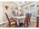 Inviting dining room with natural light, decorative rug, and traditional wooden furniture for elegant meals at 704 Compass Pointe Dr, North Myrtle Beach, SC 29582