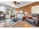 Cozy sunroom with a brick wall, comfortable seating, and lots of natural light at 704 Compass Pointe Dr, North Myrtle Beach, SC 29582