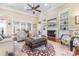 Cozy living room featuring a fireplace, built-in shelves, and comfortable seating, ideal for relaxation at 704 Compass Pointe Dr, North Myrtle Beach, SC 29582