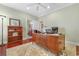 Bright office featuring a wooden desk, neutral rug, and a view to the bathroom at 704 Compass Pointe Dr, North Myrtle Beach, SC 29582