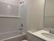 Bright bathroom featuring a shower-tub combo with white subway tile and modern fixtures at 7059 Shady Grove Rd., Conway, SC 29527