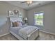 Cozy bedroom with a white bed frame, plush pillows, and neutral decor at 7059 Shady Grove Rd., Conway, SC 29527