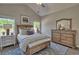 Comfortable bedroom with a wooden bed, dresser, and bedside tables at 7059 Shady Grove Rd., Conway, SC 29527