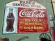 Colorful mural depicting Coca-Cola advertisements on a brick wall, capturing vintage Americana charm at 7059 Shady Grove Rd., Conway, SC 29527