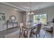 A dining room featuring a chandelier, neutral colors, and a decorative rug at 7059 Shady Grove Rd., Conway, SC 29527