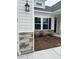 The home has black shutters and a front lawn with mulch and well-maintained landscaping at 7059 Shady Grove Rd., Conway, SC 29527