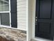 Home featuring black front door and complementary stone and siding exterior at 7059 Shady Grove Rd., Conway, SC 29527
