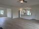 Bright, open living space flows into the kitchen with hardwood flooring and natural light at 7059 Shady Grove Rd., Conway, SC 29527