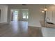 Open-concept home showcasing seamless flow from living area to a modern kitchen with granite countertops at 7059 Shady Grove Rd., Conway, SC 29527