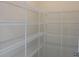 Walk-in pantry with white wire shelving for ample storage space at 7059 Shady Grove Rd., Conway, SC 29527