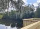 Scenic view of a pond with Spanish moss draped from trees, and a new dock construction at 7059 Shady Grove Rd., Conway, SC 29527