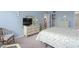 Light and bright bedroom features a large dresser with mounted television and comfortable bed at 7601 N Ocean Blvd. # 4-D, Myrtle Beach, SC 29572