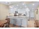 Well-lit kitchen featuring stainless steel appliances, stone countertops, and a breakfast bar at 7601 N Ocean Blvd. # 4-D, Myrtle Beach, SC 29572