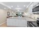 Modern kitchen showing counter seating and view to living area and balcony at 7601 N Ocean Blvd. # 4-D, Myrtle Beach, SC 29572