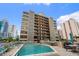 Exterior shot featuring a pool and seating area in front of an eight-story building at 7601 N Ocean Blvd. # 4-D, Myrtle Beach, SC 29572