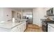 Well-lit kitchen with white cabinets, granite countertops, and stainless-steel appliances at 8051 Bear Claw Ct., Conway, SC 29526