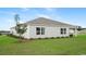 Back exterior of the house featuring a well-maintained lawn and tidy landscaping at 8054 Bear Claw Ct., Conway, SC 29526