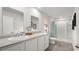 Bright bathroom featuring double sinks, white cabinets, and a walk-in shower at 8054 Bear Claw Ct., Conway, SC 29526