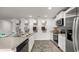 Kitchen with stainless steel appliances, a center island, white cabinetry, and a kitchen sample display at 8054 Bear Claw Ct., Conway, SC 29526